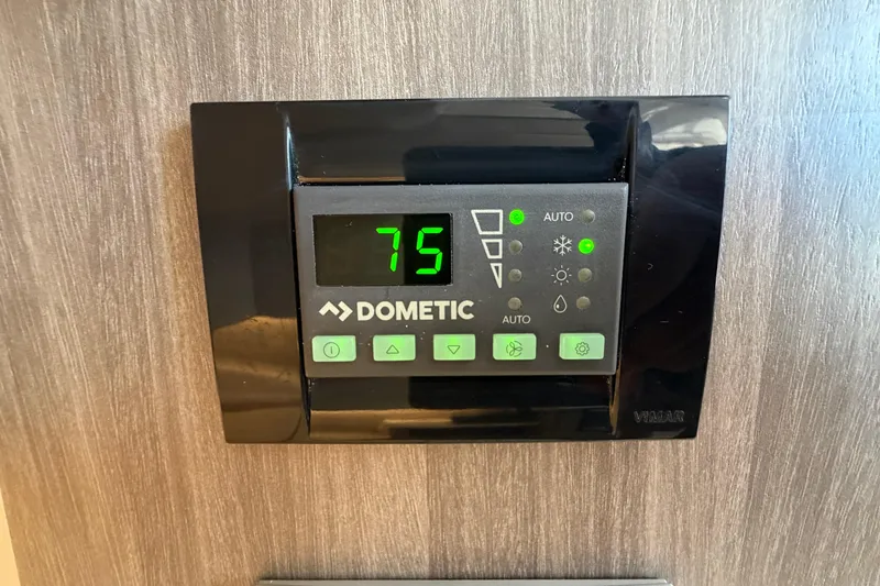 Slide: The Image of Dometic thermostat set to 75 degrees in 2021 Regal 38 SAV boat. - 30