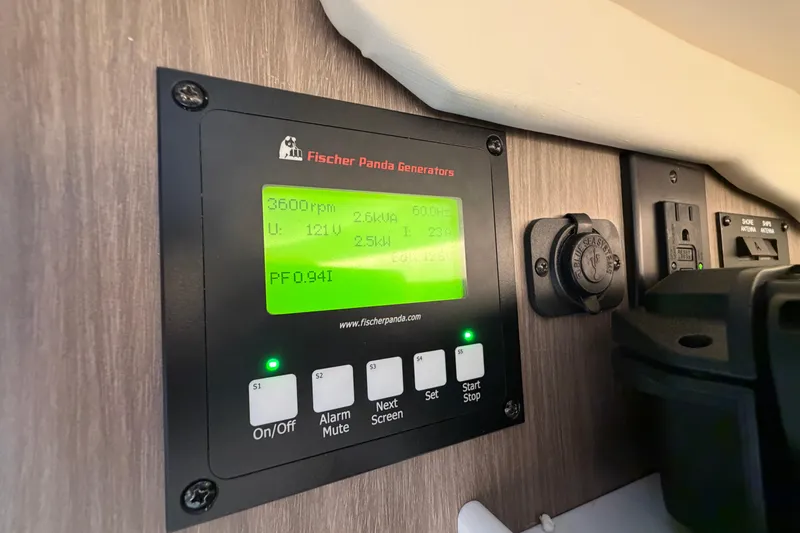 Slide: The Image of Fischer Panda generator control panel on 2021 Regal 38 SAV boat. - 31