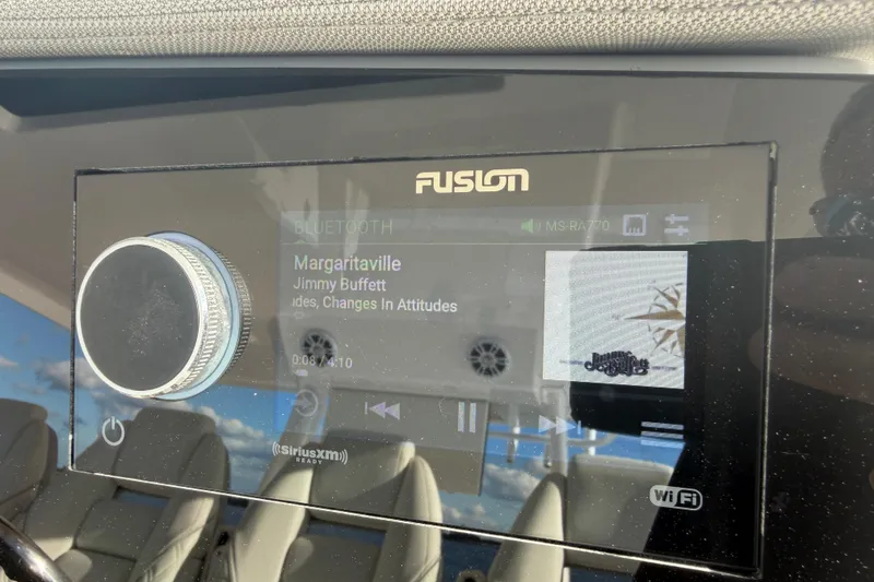 Slide: The Image of Fusion stereo system on a 2021 Regal 38 SAV playing "Margaritaville" by Jimmy Buffett. - 33