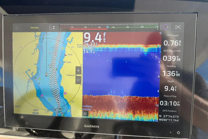 Slide: The Image of Garmin marine GPS display on 2021 Regal 38 SAV, showing navigation and depth data. - 34