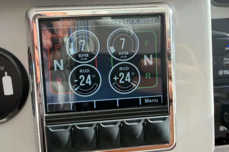 Slide: The Image of Joystick control panel on a 2021 Regal 38 SAV boat, displaying RPM and rudder angles. - 36