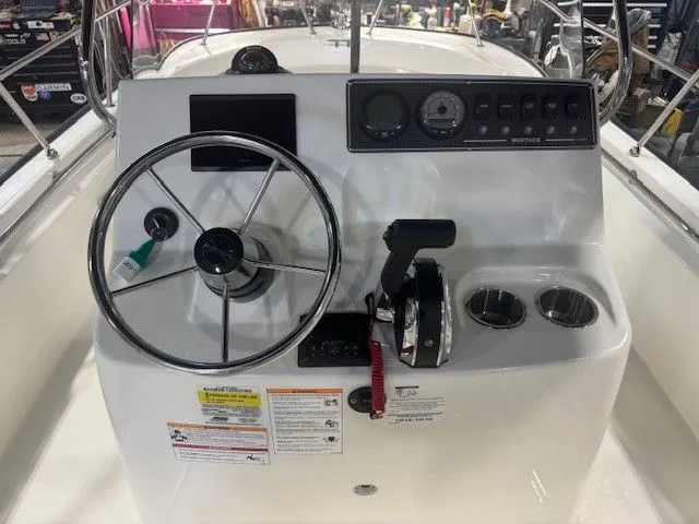 Slide: The Image of 2025 Boston Whaler 190 Montauk boat console with steering wheel. - 6