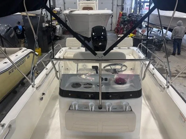 Slide: The Image of Interior view of a 2025 Boston Whaler 190 Montauk boat in a workshop. - 9