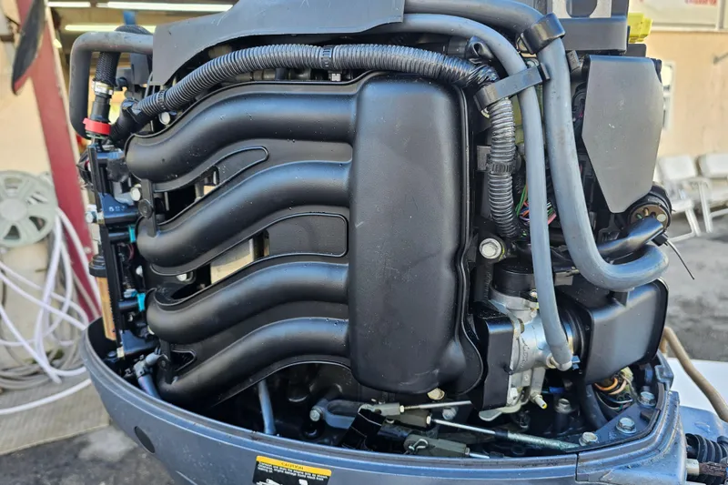 Slide: The Image of 2002 Maverick 17 HPX Mirage Tunnel boat engine close-up, showcasing intricate components. - 11