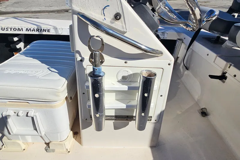 Slide: The Image of 2002 Maverick 17 HPX Mirage Tunnel boat interior with rod holders and seating. - 17