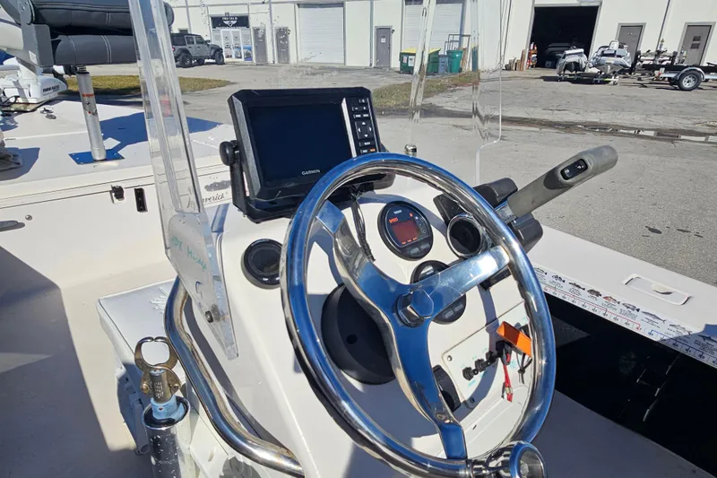 Slide: The Image of 2002 Maverick 17 HPX Mirage Tunnel boat console with steering wheel and Garmin display. - 19