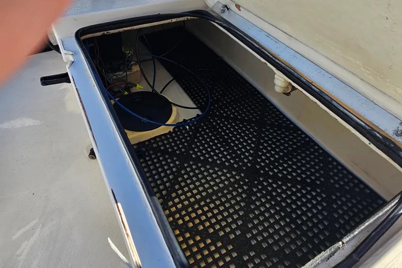 Slide: The Image of Open storage compartment of 2002 Maverick 17 HPX Mirage Tunnel boat. - 21