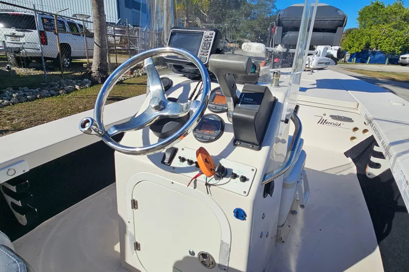 Slide: The Image of 2002 Maverick 17 HPX Mirage Tunnel boat console with steering wheel and controls. - 24