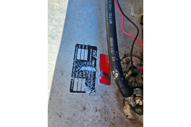 Slide: The Image of Close-up of a 2002 Maverick 17 HPX Mirage Tunnel boat label and wiring. - 29