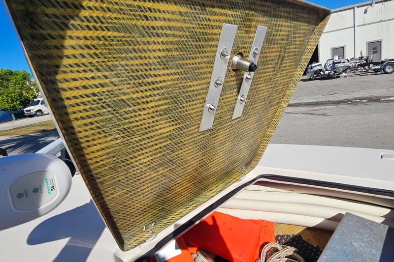 Slide: The Image of 2002 Maverick 17 HPX Mirage Tunnel boat hatch open, revealing storage with ropes and equipment. - 30