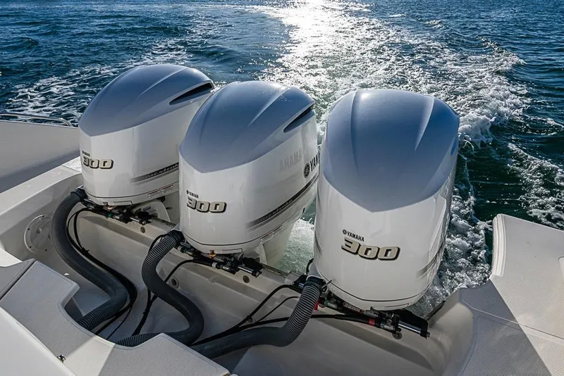Slide: The Image of Triple Yamaha 300 engines on a 2020 Pursuit DC 365 Dual Console boat. - 31