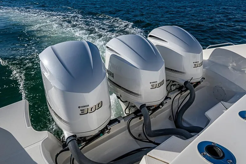 Slide: The Image of Triple Yamaha 300 engines on 2020 Pursuit DC 365 Dual Console boat. - 32