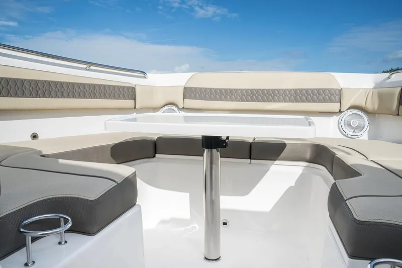 Slide: The Image of 2020 Pursuit DC 365 Dual Console boat cruising on a sunny day with palm trees in background. - 5