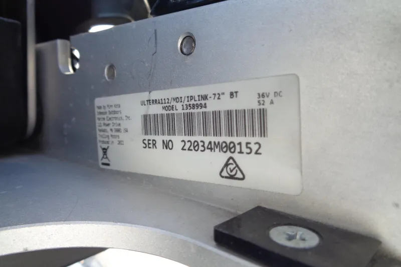 Slide: The Image of Label on Vexus DVX22 boat component, showing serial number and model details. - 14