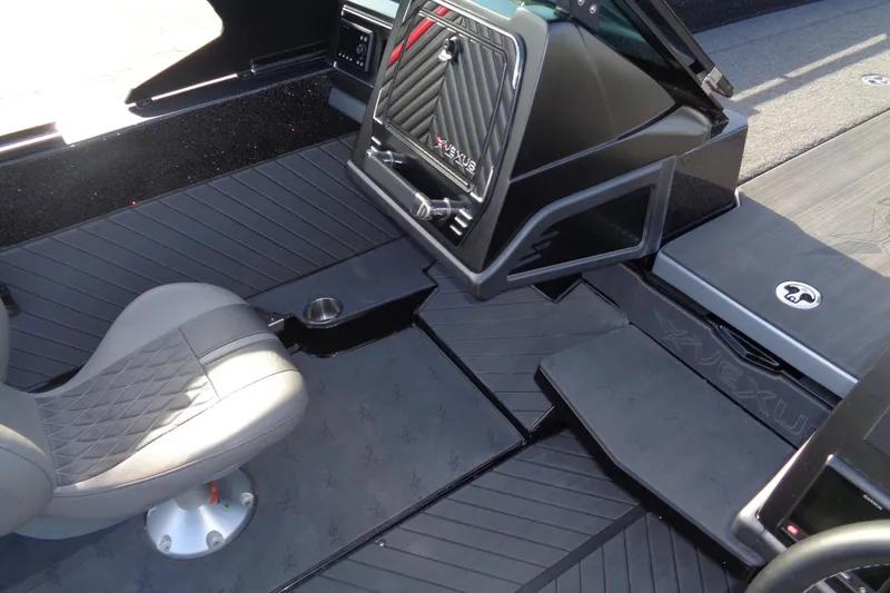 Slide: The Image of 2022 Vexus DVX22 boat interior with sleek seating and modern dashboard design. - 19