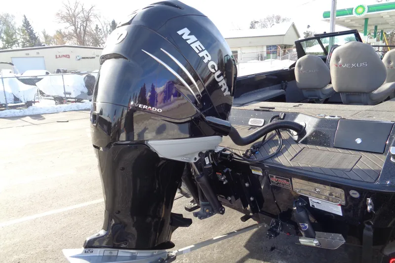 Slide: The Image of 2022 Vexus DVX22 boat with Mercury Verado outboard motor, parked outdoors. - 23