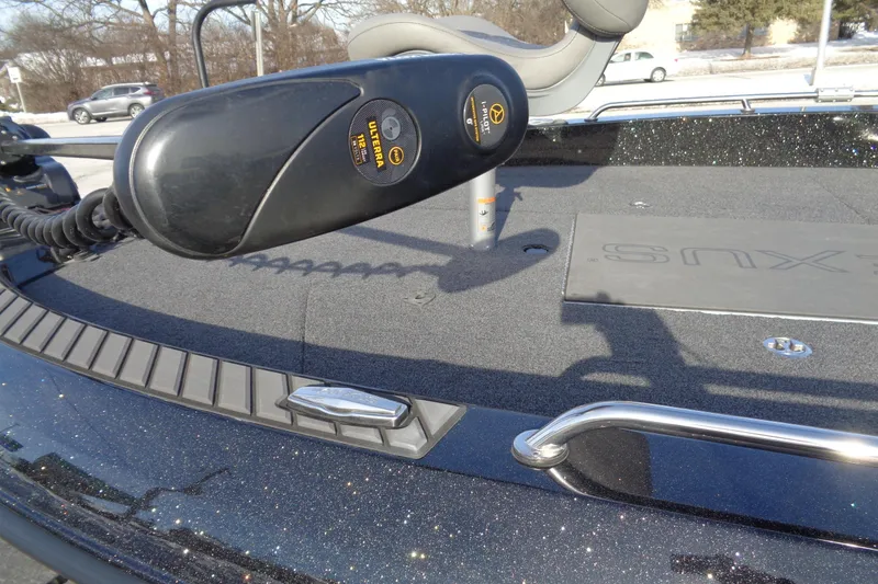 Slide: The Image of 2022 Vexus DVX22 boat deck with trolling motor and sleek design. - 8