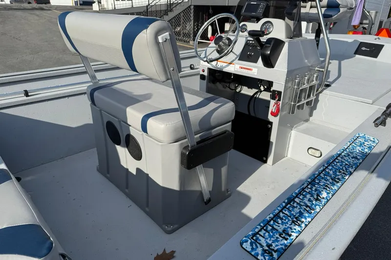 Slide: The Image of 2022 G3 Gator Tough 17 CCJ DLX boat interior with steering console and seating. - 10
