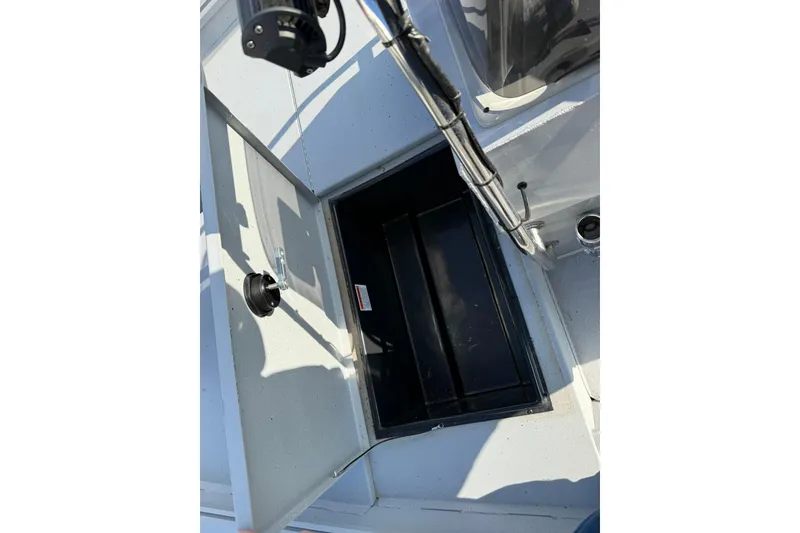 Slide: The Image of Open storage compartment on 2022 G3 Gator Tough 17 CCJ DLX boat. - 14