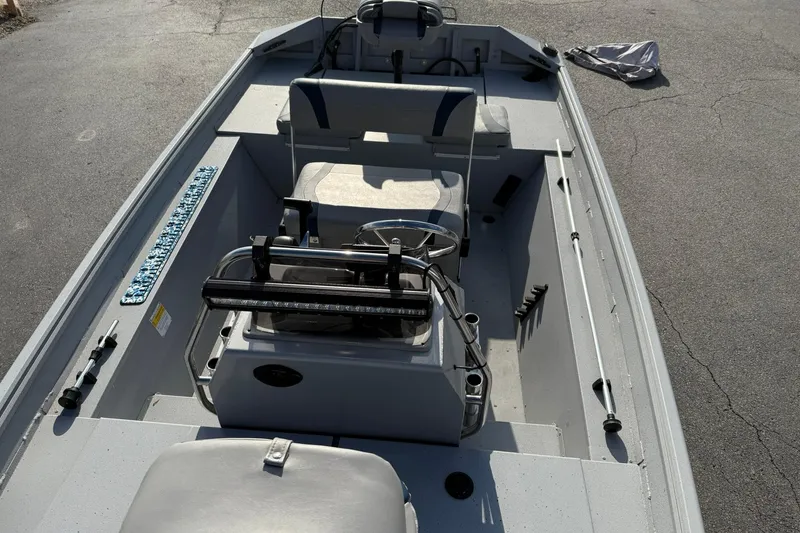 Slide: The Image of 2022 G3 Gator Tough 17 CCJ DLX boat interior with seating and steering console. - 15