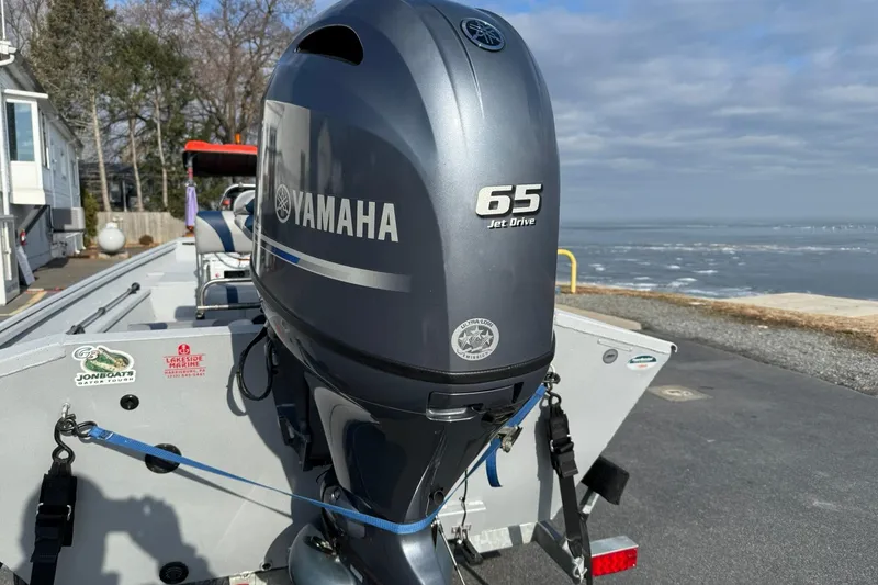 Slide: The Image of 2022 G3 Gator Tough 17 CCJ DLX boat with Yamaha 65 Jet Drive engine by the water. - 4