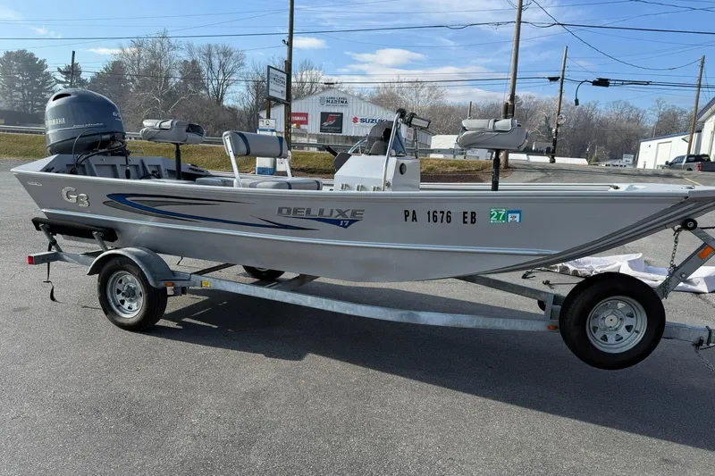 Slide: The Image of 2022 G3 Gator Tough 17 CCJ DLX boat on trailer, parked outdoors. - 6