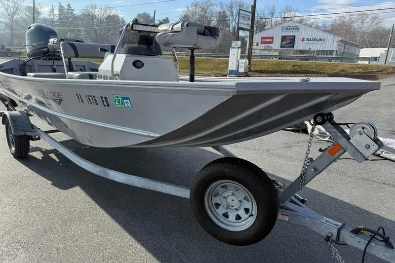 Slide: The Image of 2022 G3 Gator Tough 17 CCJ DLX boat on trailer, parked outdoors. - 7