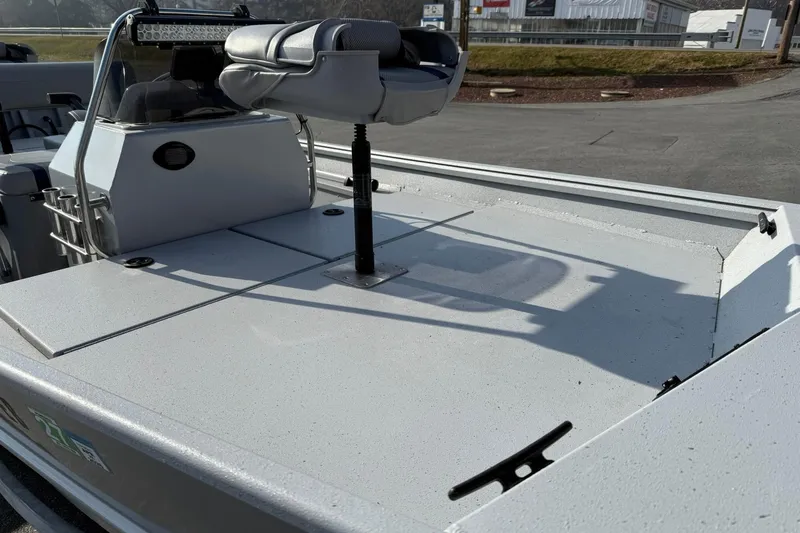 Slide: The Image of 2022 G3 Gator Tough 17 CCJ DLX boat, featuring a spacious deck and seating area. - 8