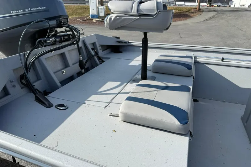 Slide: The Image of 2022 G3 Gator Tough 17 CCJ DLX boat interior with seating and motor. - 9