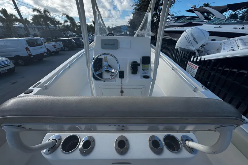 Slide: The Image of 2021 Cobia 220 Center Console boat interior with steering wheel and controls. - 3