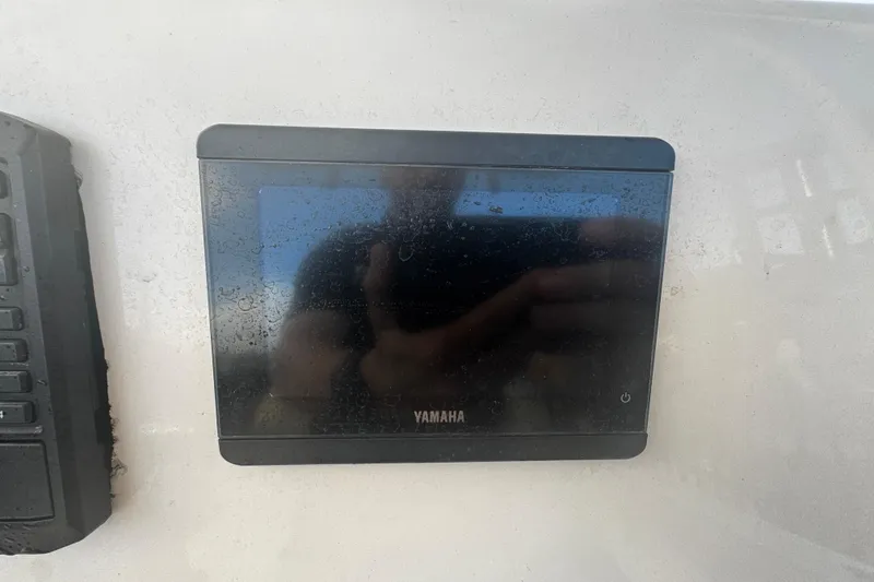 Slide: The Image of Yamaha display on 2021 Cobia 220 Center Console boat dashboard. - 8