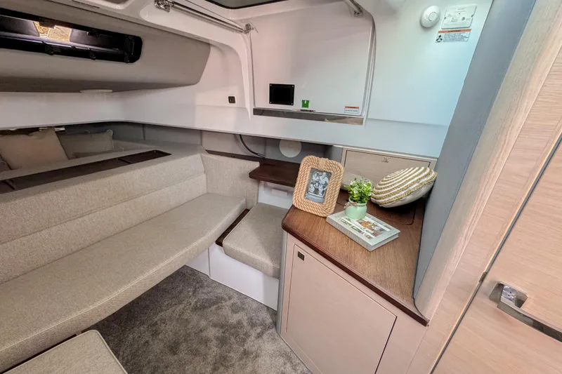Slide: The Image of 2024 Axopar 45 XC Cross Cabin interior with cozy seating and elegant decor. - 25