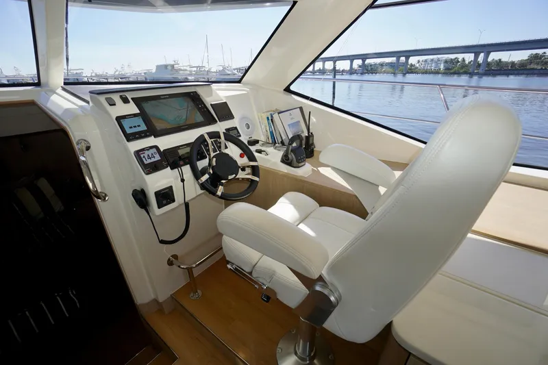 Slide: The Image of Cockpit of 2020 Aquila 44 Yacht with modern navigation equipment and luxurious seating. - 10