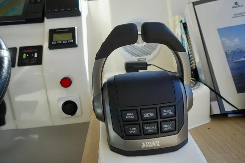 Slide: The Image of Volvo Penta control panel on 2020 Aquila 44 Yacht dashboard, featuring various operational buttons. - 12