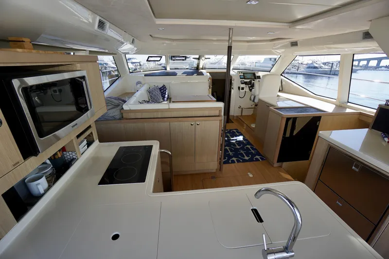 Slide: The Image of Interior of 2020 Aquila 44 Yacht with modern kitchen and panoramic windows. - 14