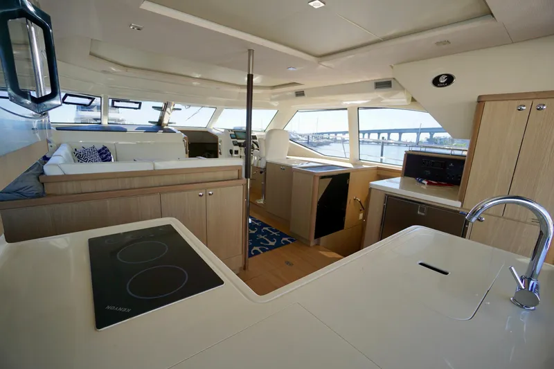 Slide: The Image of Interior of 2020 Aquila 44 Yacht featuring modern kitchen and spacious seating area. - 15