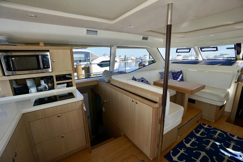Slide: The Image of Luxurious interior of 2020 Aquila 44 Yacht with modern kitchen and seating area. - 17