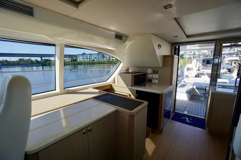 Slide: The Image of Interior of 2020 Aquila 44 Yacht with modern kitchen and scenic water view. - 19