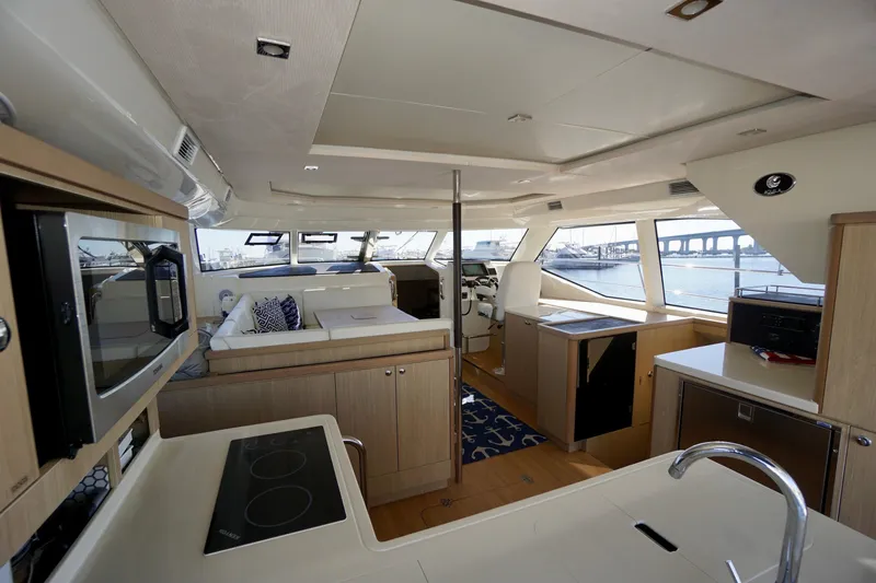 Slide: The Image of Luxurious interior of 2020 Aquila 44 Yacht with modern kitchen and panoramic windows. - 21