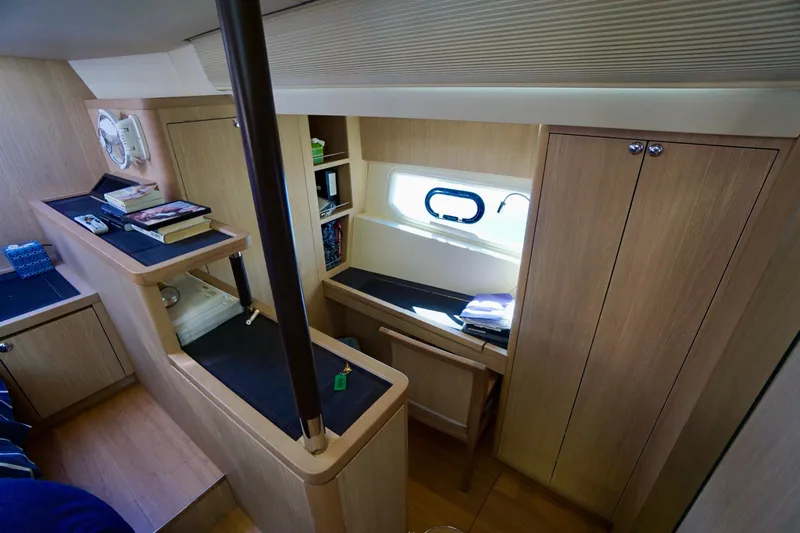 Slide: The Image of Interior of 2020 Aquila 44 Yacht with wooden cabinetry and window. - 25