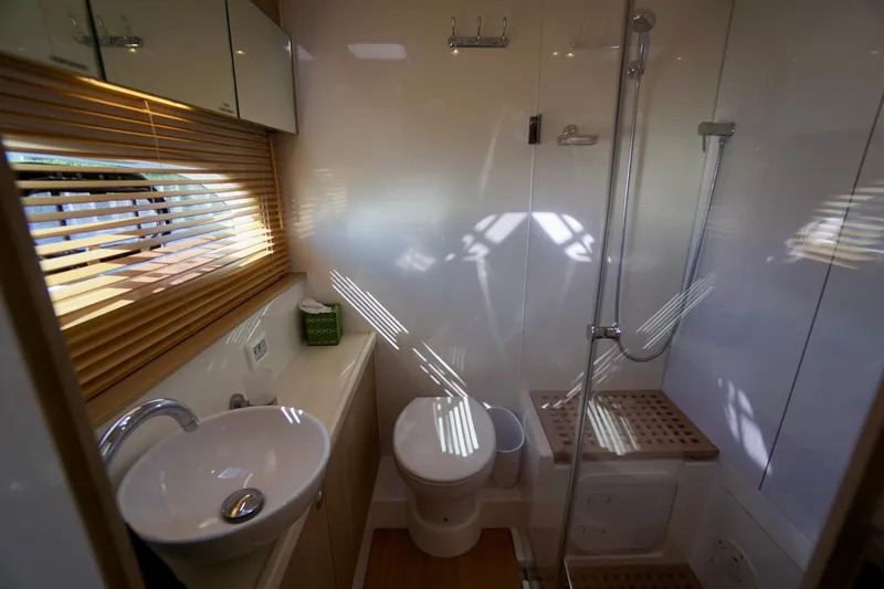 Slide: The Image of Modern bathroom interior on 2020 Aquila 44 Yacht with shower and sink. - 31