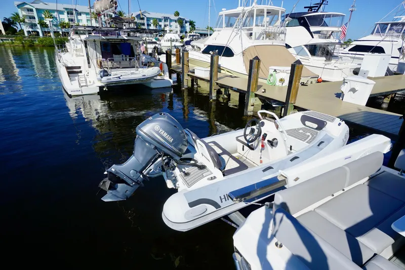 Slide: The Image of Docked Aquila 44 Yacht, 2020 model, with Yamaha outboard motor in marina. - 6