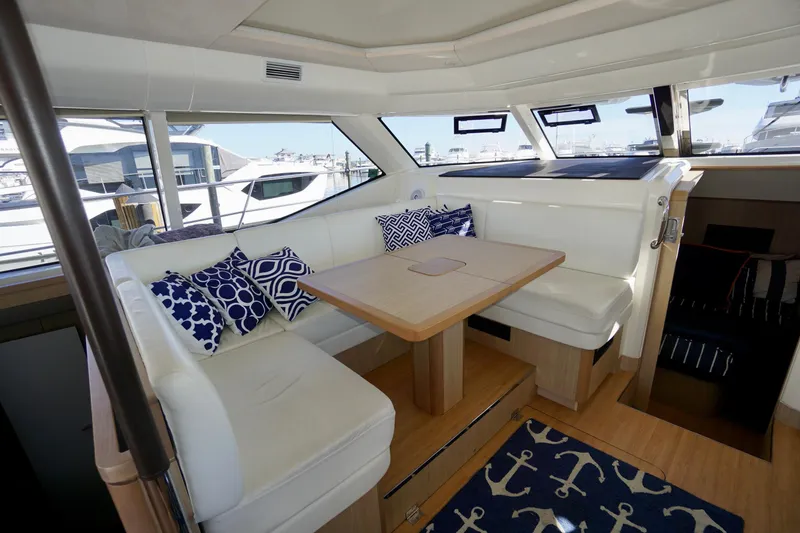 Slide: The Image of Interior of 2020 Aquila 44 Yacht with white seating and nautical-themed decor. - 9