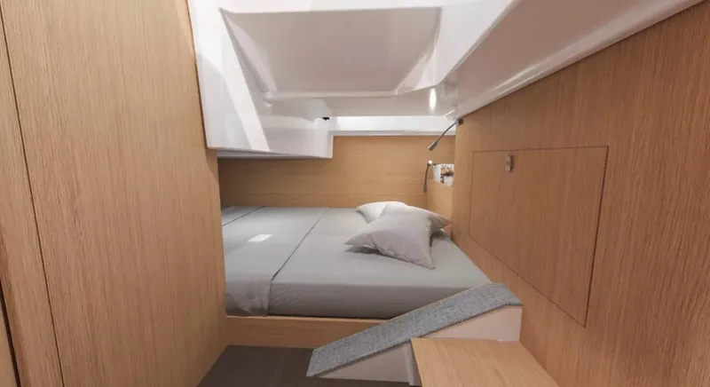 Slide: The Image of 2024 Beneteau Flyer 10 cabin interior with bed and wooden finish. - 16