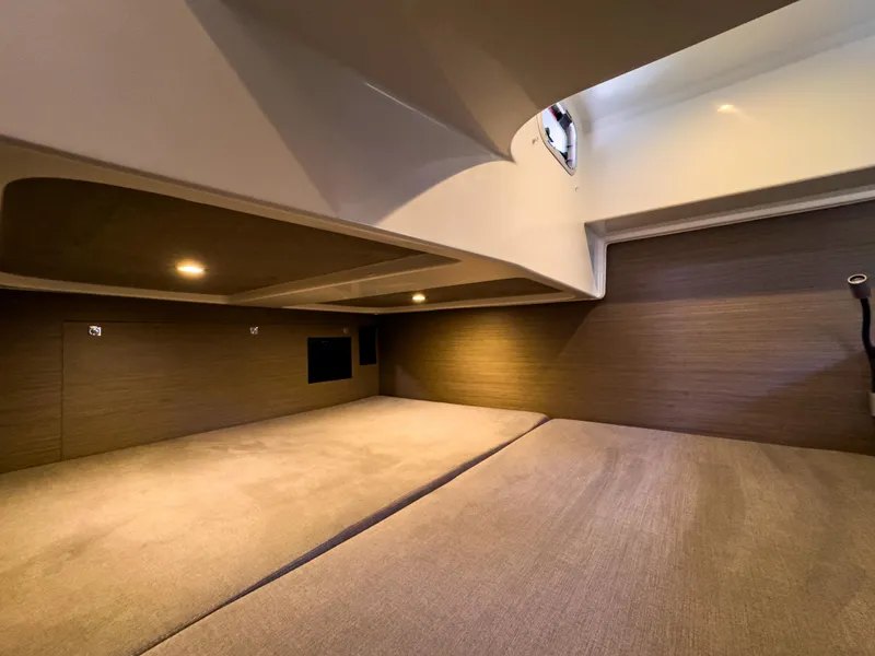 Slide: The Image of 2024 Beneteau Flyer 10 cabin interior with modern design and ambient lighting. - 17