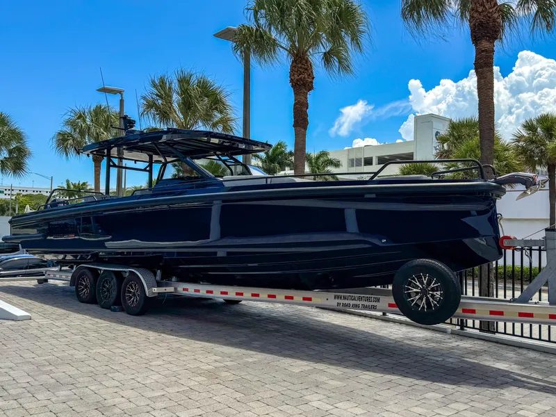 The Image of 2024 BRABUS Shadow 1000 ST boat on trailer, surrounded by palm trees. - 0