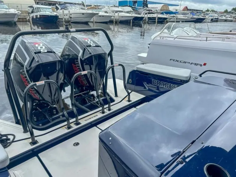 Slide: The Image of 2024 BRABUS Shadow 1000 ST boat with twin outboard engines docked at marina. - 19