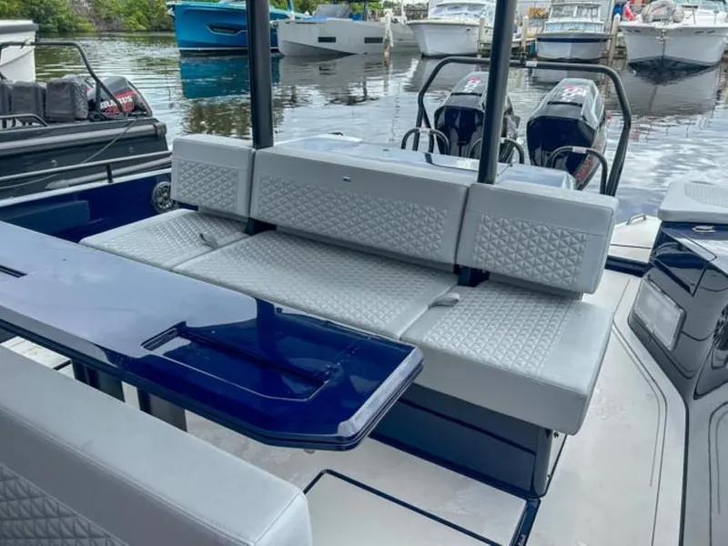 Slide: The Image of 2024 BRABUS Shadow 1000 ST luxury boat interior with seating and table. - 20