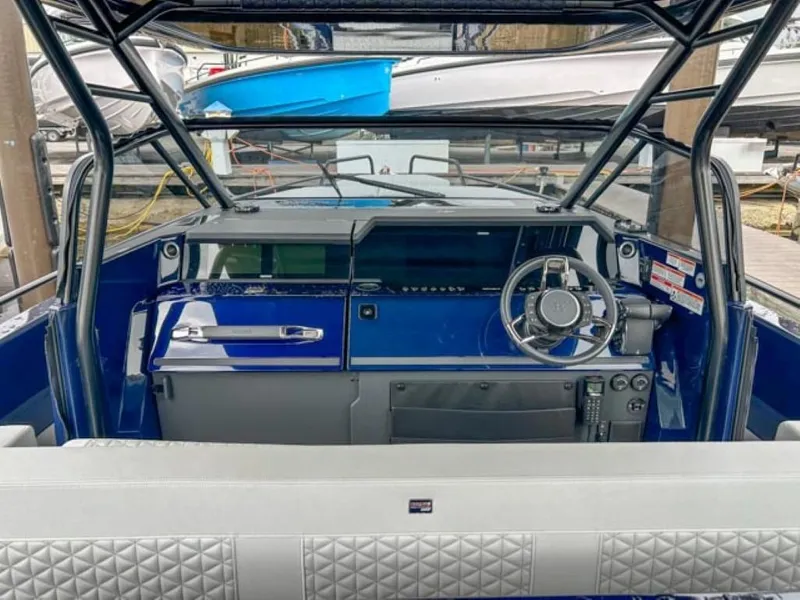 Slide: The Image of Cockpit of 2024 BRABUS Shadow 1000 ST luxury boat with blue dashboard and modern steering wheel. - 29