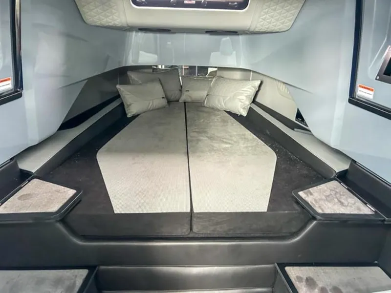 Slide: The Image of 2024 BRABUS Shadow 1000 ST interior cabin with bed and pillows. - 12